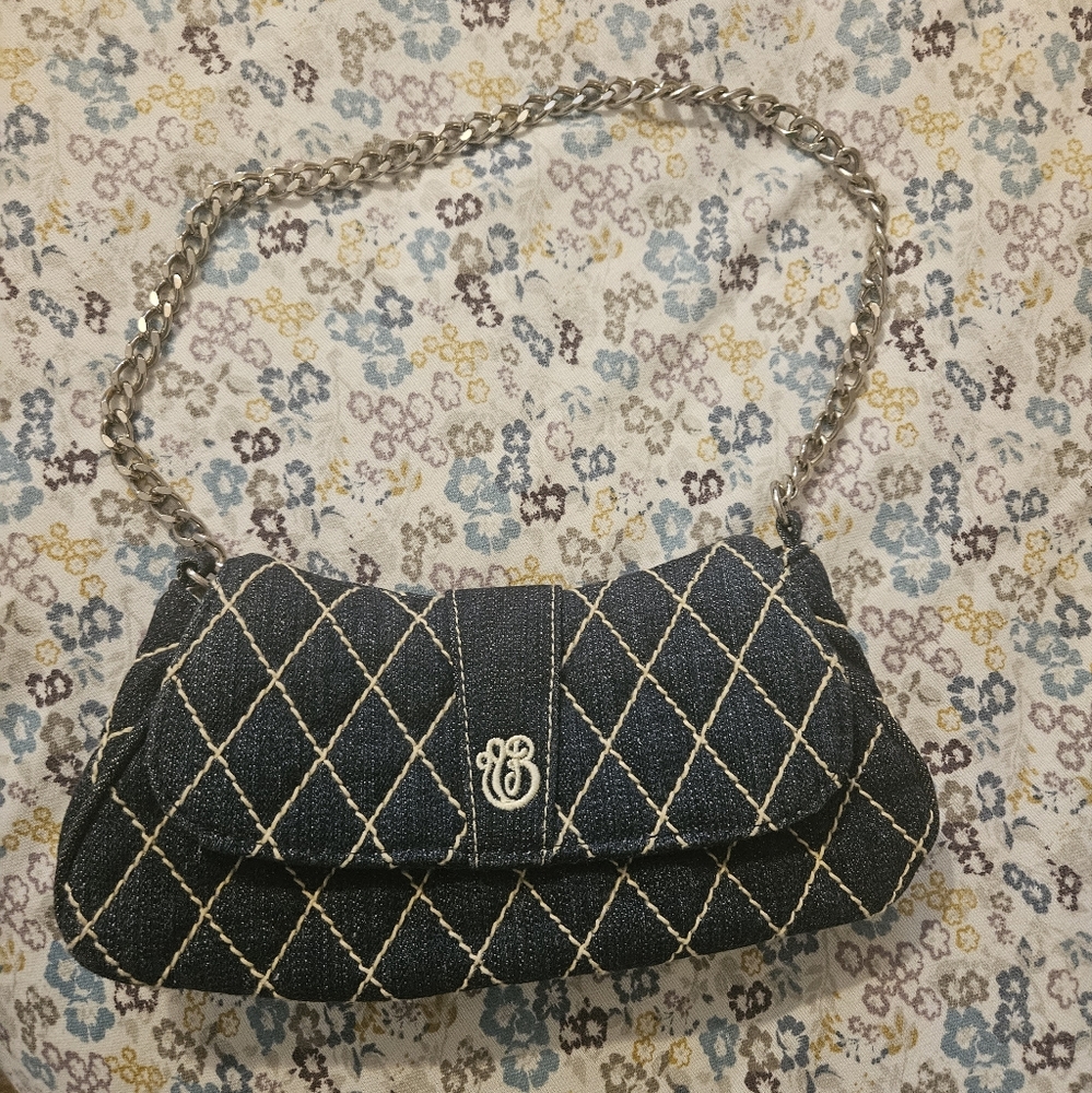 Super cute Jean Vera Bradley clutch w sliver handle.